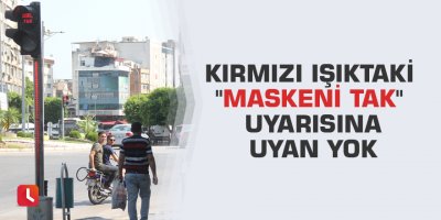 Kırmızı ışıktaki "Maskeni tak" uyarısına uyan yok