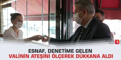 Esnaf, denetime gelen valinin ateşini ölçerek dükkana aldı