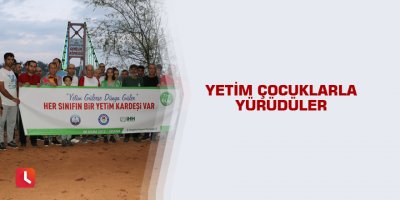 Yetim çocuklarla yürüdüler
