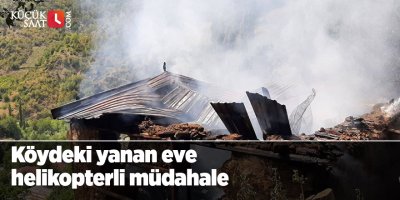 Köydeki yanan eve helikopterli müdahale