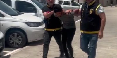 Kolyesini çalmak istediği kadından dayak yedi