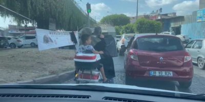 Motosikletle halı yıkama makinesi taşıdılar