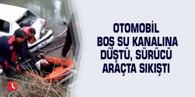 Otomobil boş su kanalına düştü, sürücü araçta sıkıştı