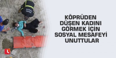 Köprüden düşen kadını görmek için sosyal mesafeyi unuttular