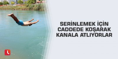 Serinlemek için caddede koşarak kanala atlıyorlar